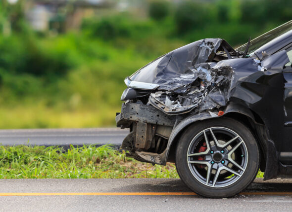 Black car get damaged by accident on the road